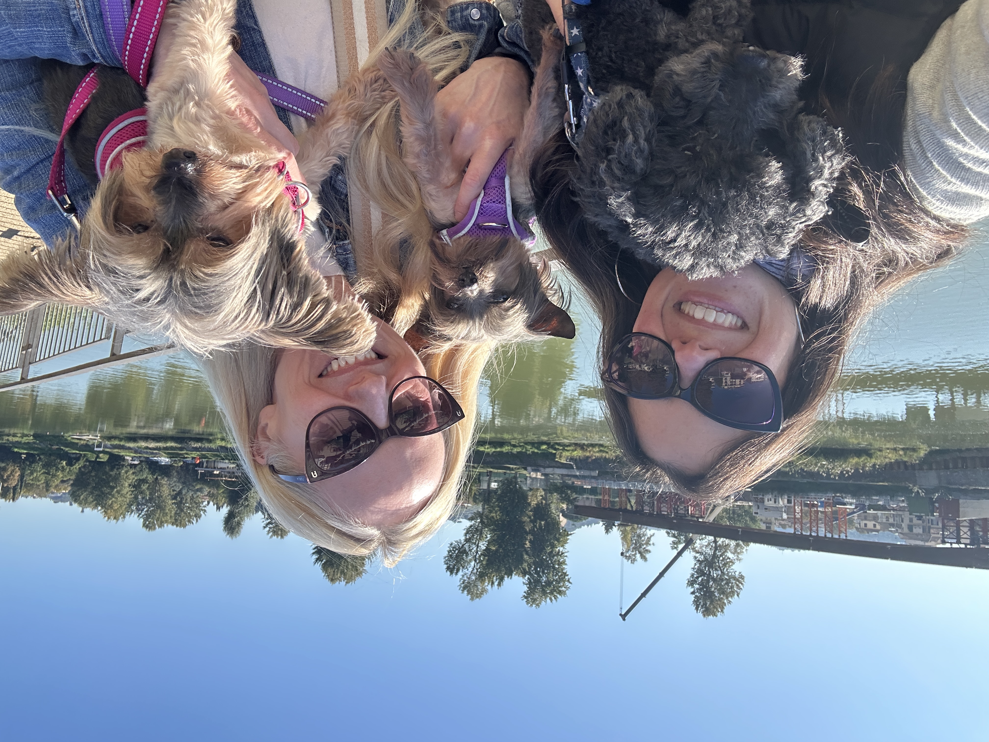 Friends with dogs by the Arno in Florence
